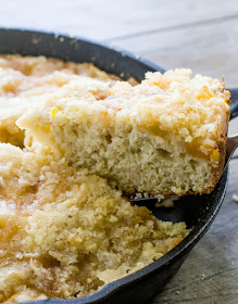 Use fresh or frozen peaches to make all of tour breakfast dreams come true. This cake is perfect for tea time too. It's an old fashioned recipe that will quickly become a an all time favorite. First slice of peach breakfast cake coming out of the pan