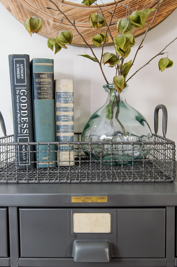I LOVE this piece!  A vintage metal hardware cabinet gets restored and turned into perfect home storage. www.littlehouseoffour.com