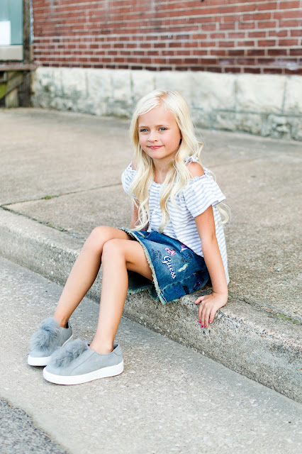 little girl fashion outfit denim skirt patches fur pom shoes sneakers off the shoulder