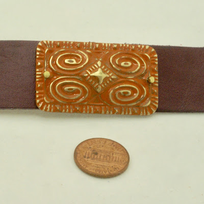 Size of leather strap compared to US penny