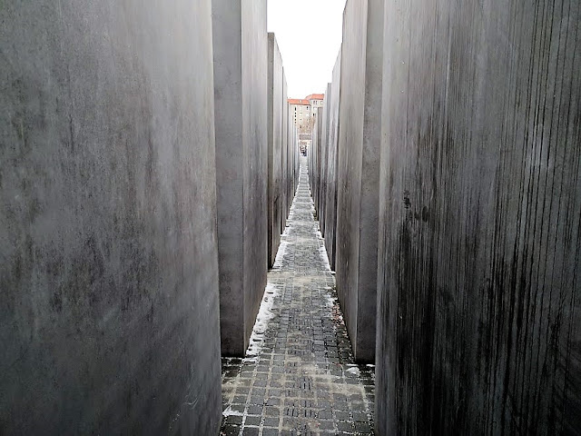 Memorial to the Murdered Jews concrete slabs arranged in a grid pattern on a sloping field