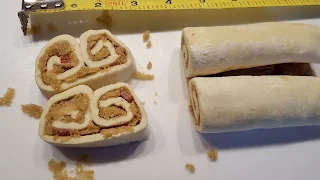 pastry slices filled with brown sugar and bacon, unbaked, measuring tape