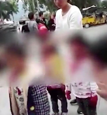 1 Knife-wielding man attacks 11 children after scaling fence of a nursery in China