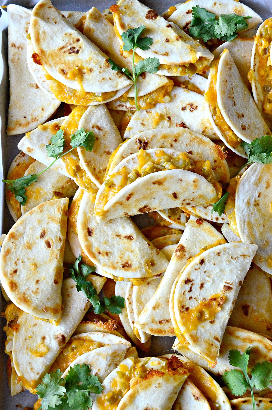 These cheesy,salty quesadilla crisps are perfect party fare. Make ahead and reheat in 5 minutes and guaranteed to be a party pleaser! www.thisishowicook.com #Mexicanfood #quesadillas #appetizer