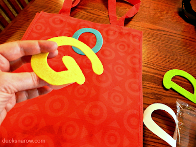 Self adhesive alphabet letters make this craft easy to make! #DIY puppy busy bag tutorial, how to make a dog busy bag