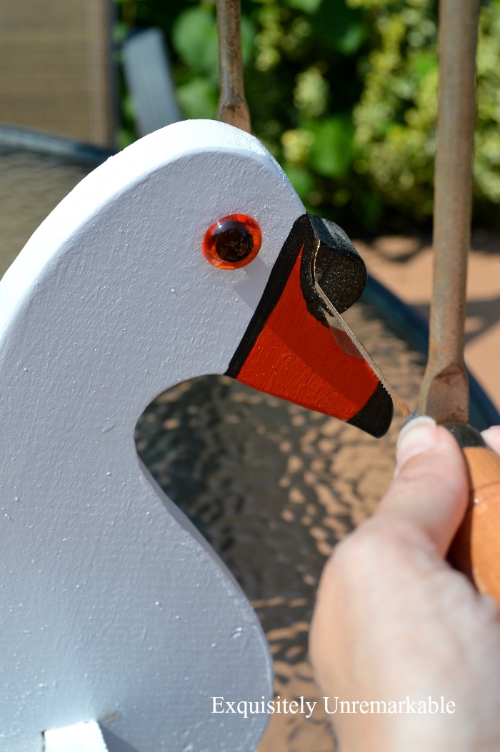 Cutting beak off of wooden swan planter