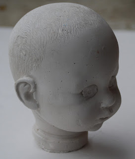 Creepy Plaster Casting of a Dolls Head