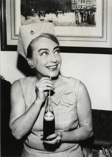 Joan Crawford sips pepsi through a straw. The star and widow of the Pepsi Chairman insisted on joining the Pepsi Board after his death. Jingles and other stories of The American Dream. marchmaton.com Joan Crawford sips pepsi through a straw. The star and widow of the Pepsi Chairman insisted on joining the Pepsi Board after his death. Jingles and other stories of The American Dream. marchmaton.com