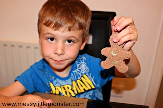 Salt dough fingerprint gingerbread man ornament. A DIY Christmas keepsake idea for toddlers, preschoolers and older kids to make using a cinnamon salt dough recipe.