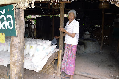 Thai lady selling salt in Bo Kluea, Nan province, North Thailand Ancient Salt Pits of Bo Klua in Nan, North Thailand