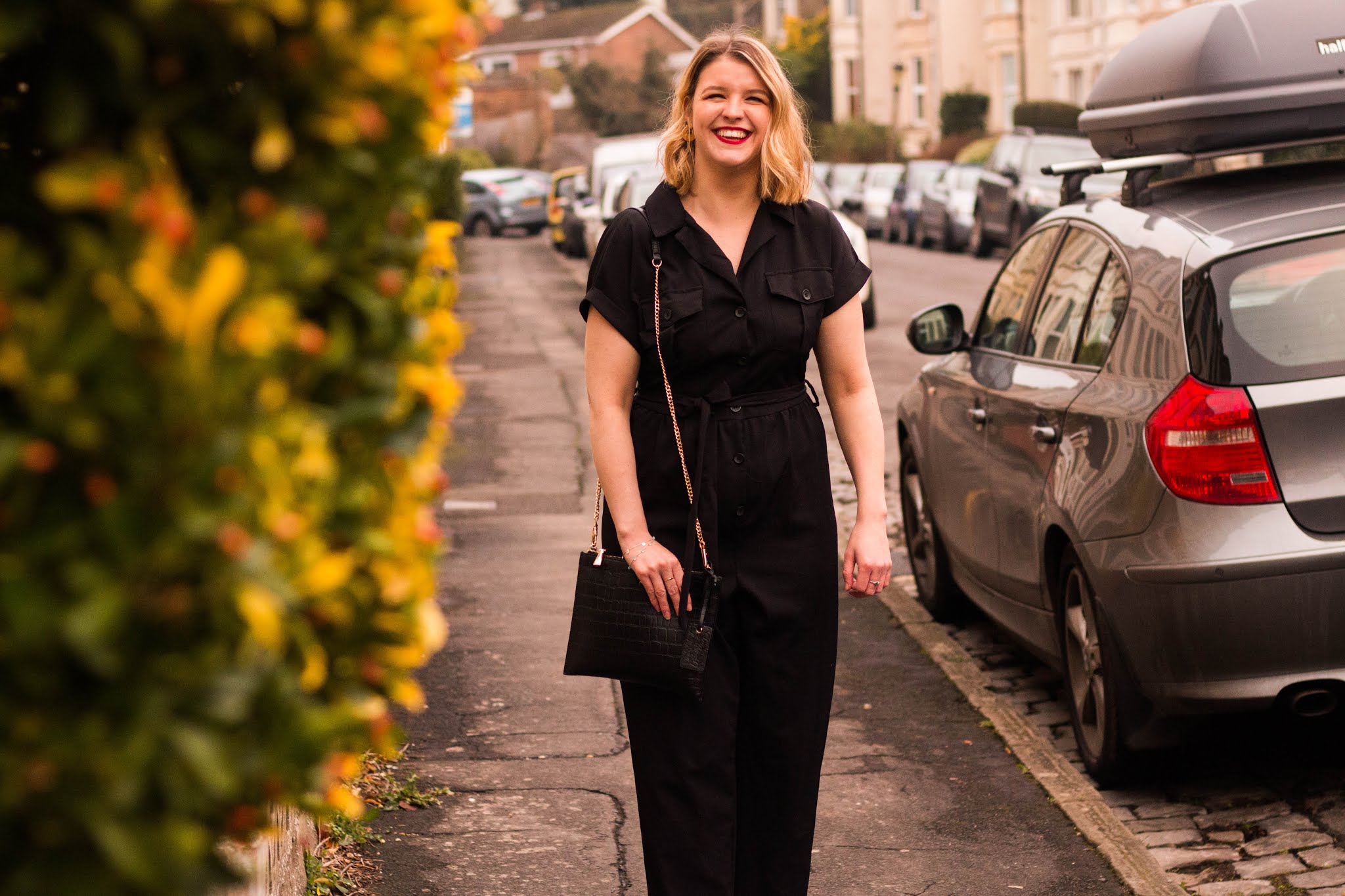 Lifestyle blogger Chloe Harriets smiling walking down the street - blogging tips