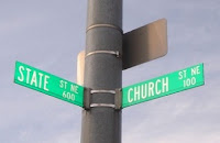 Street signs at the intersection of Church St and State St
