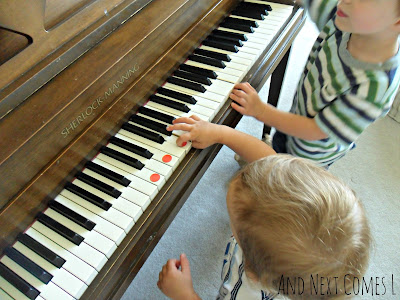 Playing chords on the piano using dot stickers from And Next Comes L
