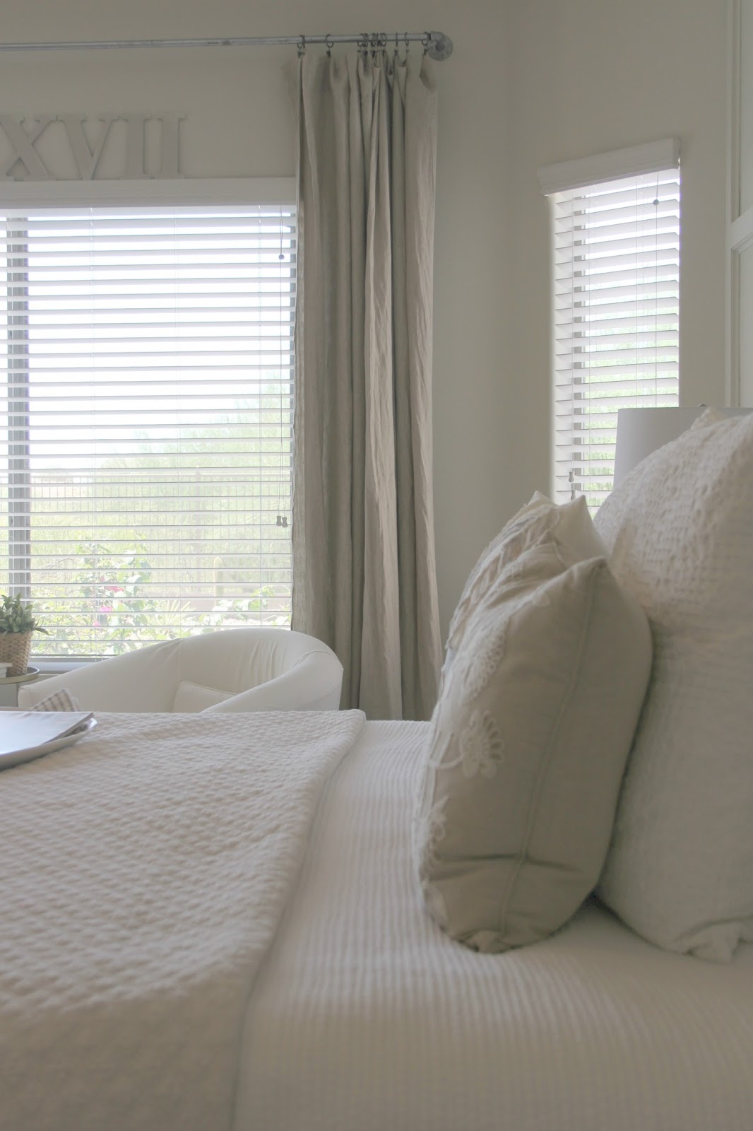 DIY bedroom decor makeover with serene, European inspired modern farmhouse style by Hello Lovely Studio