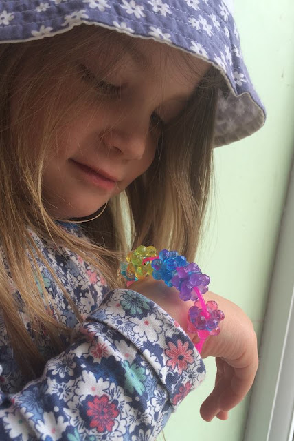 Four year old girl with the Beados Gem Designer Studio Bracelet she made.