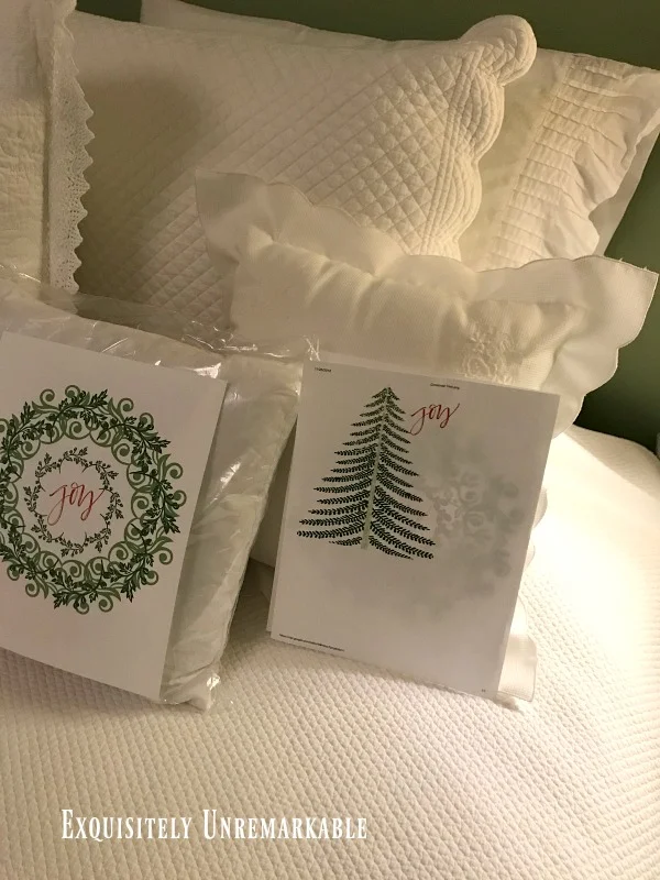 Making A Custom Pillow with wreath and tree printables on bed