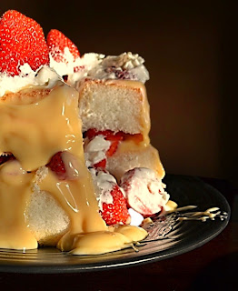 strawberries, custard, whipped cream and angel food cake