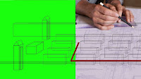 A photo of diagram on a green background with a hand drawing on it.