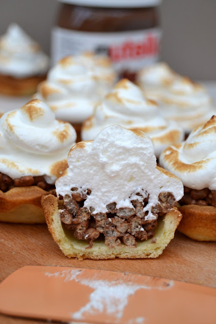 Puffed rice cereal and Nutella in a pie shell topped with toasted mallowy meringue 