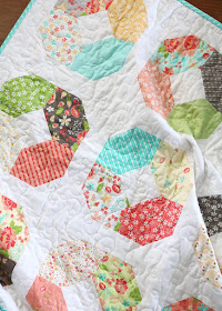 Charming Lucy a free charm pack baby quilt pattern from Andy of A Bright Corner