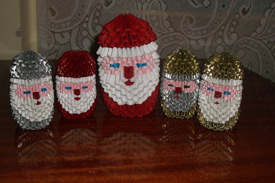 5 3d origami Santa Claus made from paper
