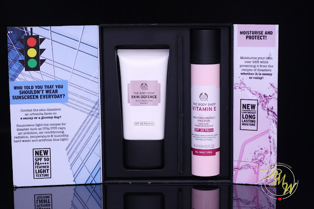 a photo of The Body Shop Skin Defense Multi Protection Essence SPF50 and The Body Shop Vitamin E Moisture Protect Emulsion 