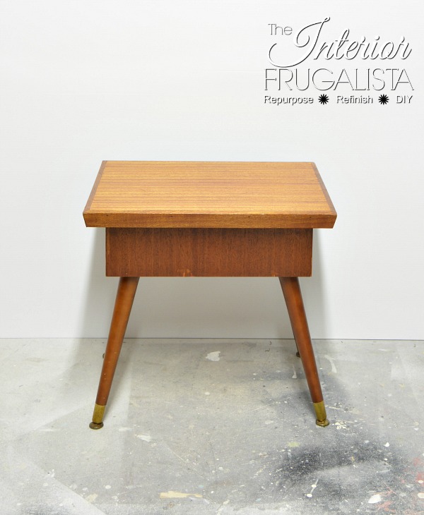 A unique vintage mid-century modern wood sewing or knitting box table with hinged top and hidden sewing storage before makeover.