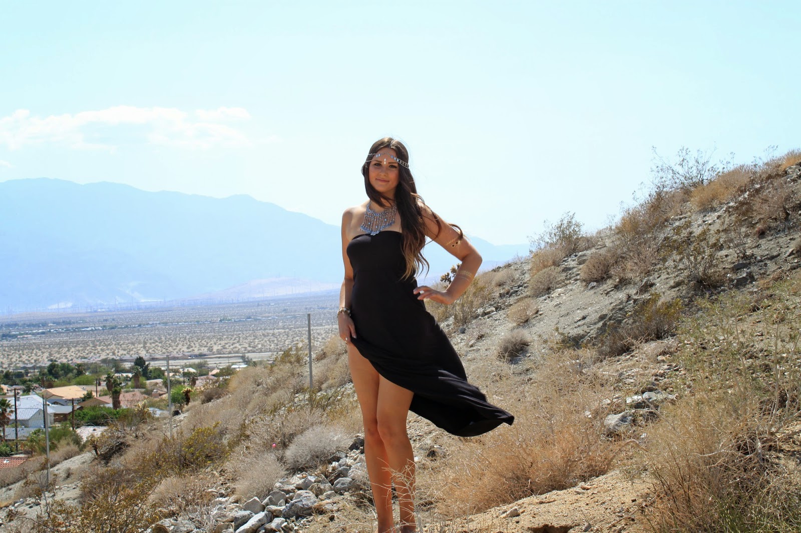 Fashion blogger Mash Elle models a black Forever 21 dress during Coachella in Palm Springs