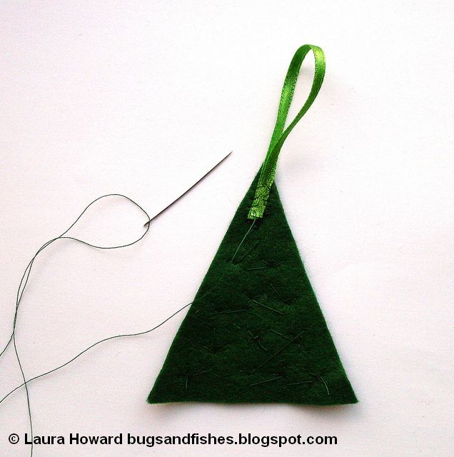 Sew some colourful felt Christmas tree ornaments with this beginner-friendly free DIY sewing tutorial adding a ribbon loop to a felt Christmas tree decoration