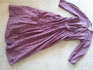 Reproduction cotton plaid day dress with narrow coat sleeves, c.1862-1865. Reproduction cotton plaid day dress with narrow coat sleeves, c.1862-1865.