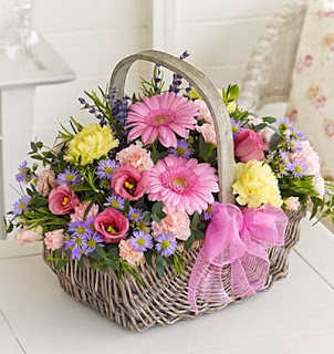 mother's day flower basket with pink ribbons