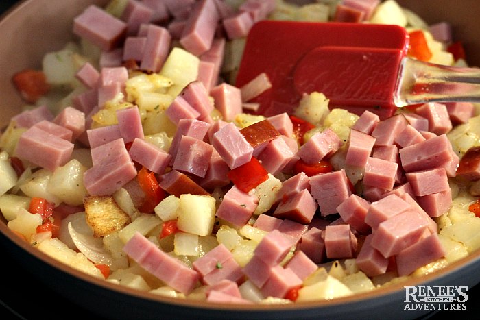 Ham Hash by Renee's Kitchen Adventures in skillet on stove with red spatula