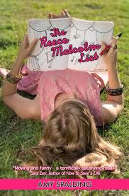 A blonde girl rests on the grass while holding a pen and a notebook that reads "The Reece Malcolm List"