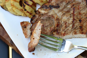 Grilled Pork Chop sliced on white platter