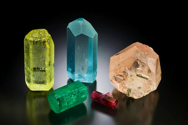 Varieties of Beryl: Emerald, Aquamarine, Morganite, Bixbite, and Heliodorl.