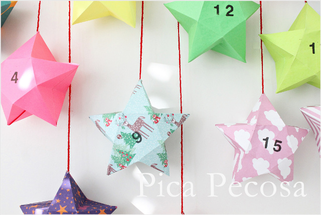 calendario-adviento-diy-trozo-madera-pinzas-ropa-adornadas-washi-tape-cajas-papel-forma-estrella