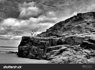 friendship, black and white photograph two women go hand in hand climbing a cliff by the sea friendship, black and white photograph two women go hand in hand climbing a cliff by the sea
