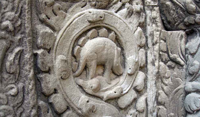This Dinosaur shouldn't exist but it does in Cambodian Temple.