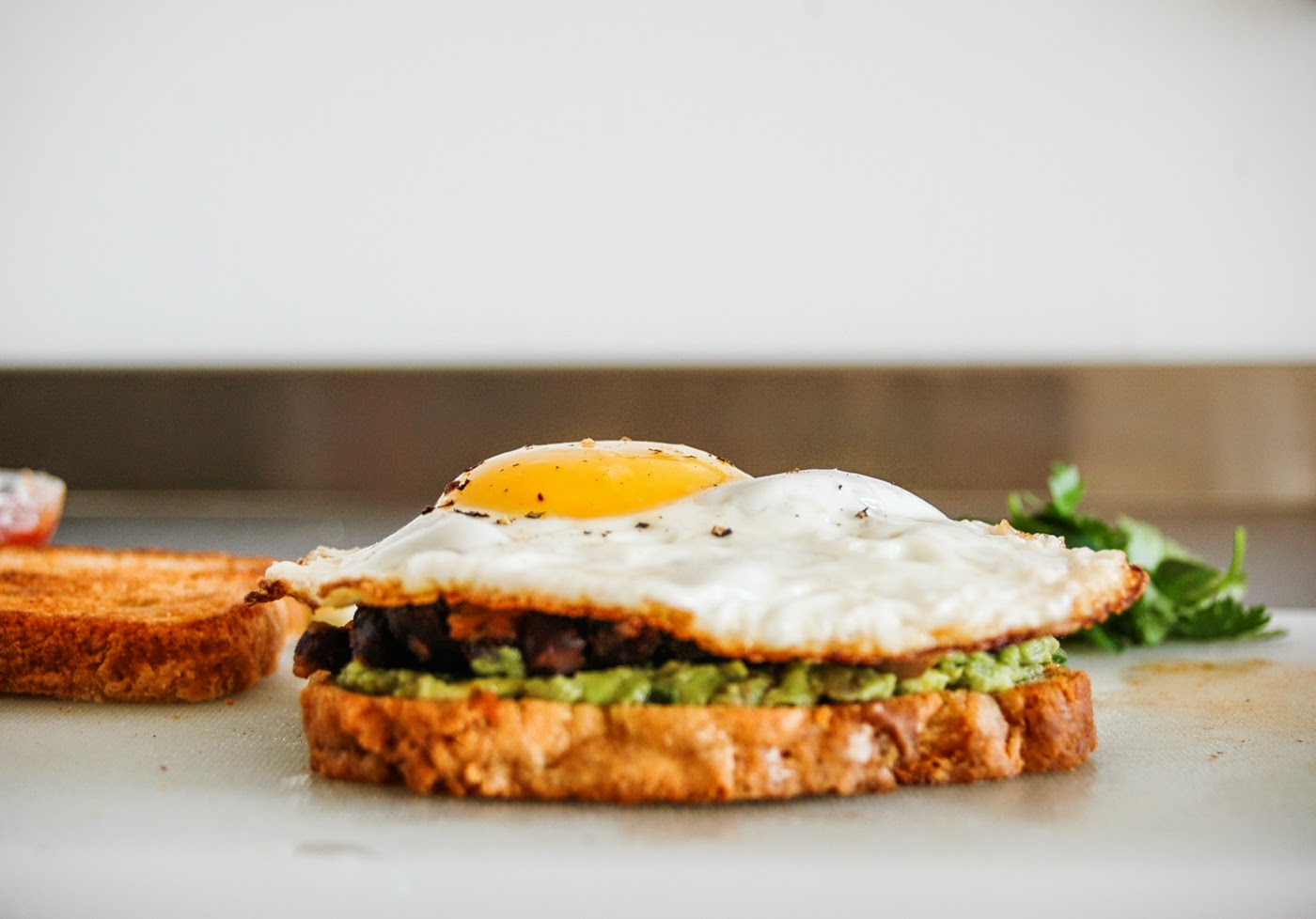 GLORIOUS SANDWICHES GRINGO chilli + black bean + guac + bacon + egg