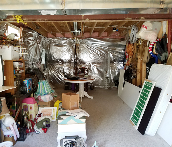 silver insulation in basement, disorganized basement