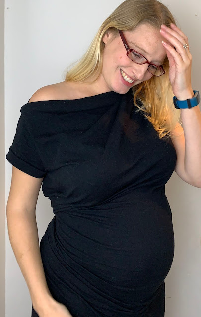 A pregnant mumma (me) in a black dress at 29 weeks pregnant