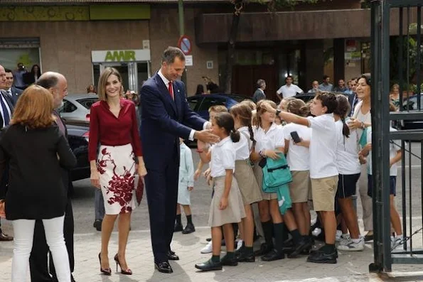 Queen Letizia attended an official lunch for Constitutional Tribunal. Felipe Varela satin blouse and floral skirt