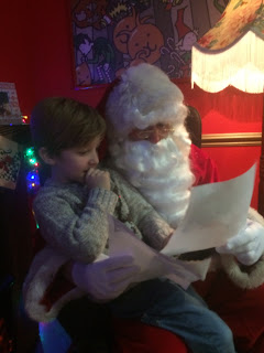 Santa reading little boy's letter