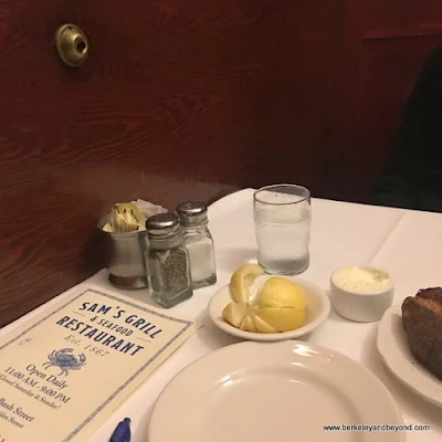 table in booth at Sam's Grill & Seafood Restaurant in San Francisco, California