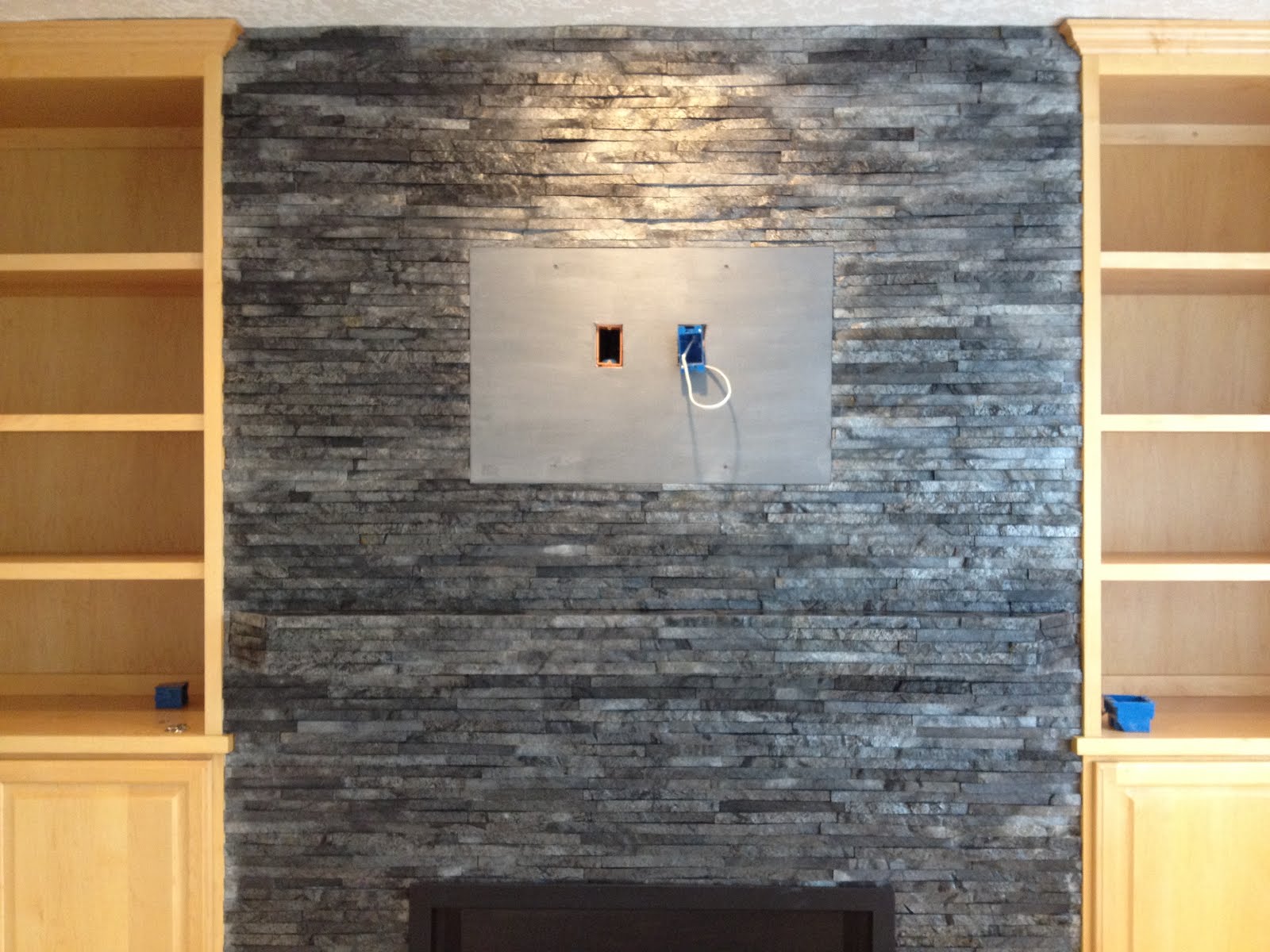 Tile & Stone Expertise: Cultured Stone fireplace with black slate hearth