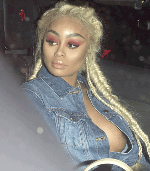 Deliberate? Blac Chyna's boobs pop out of her shirt just as paparazzi start  snapping her (photos)