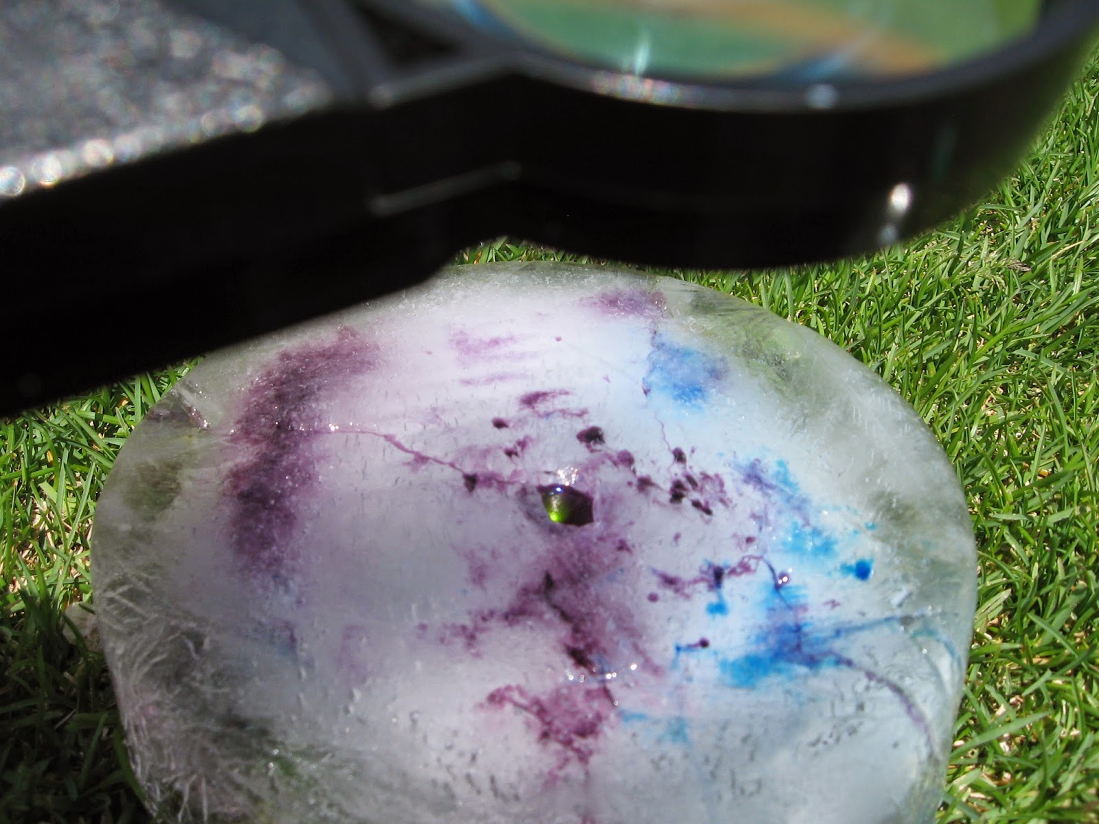 Almost Unschoolers: Summer Fun 2014 - Melting Ice With a Magnifying Glass