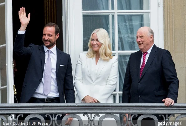 King Harald V of Norway with Crown Prince Haakon of Norway and Crown Princess Mette-Marit of Norway on the balcony at Amalienborg Palace during festivities for the 75th birthday of Queen Margrethe II Of Denmark