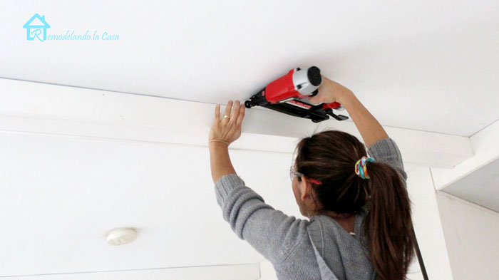Cristina Garay installing wooden beams in master bedroom