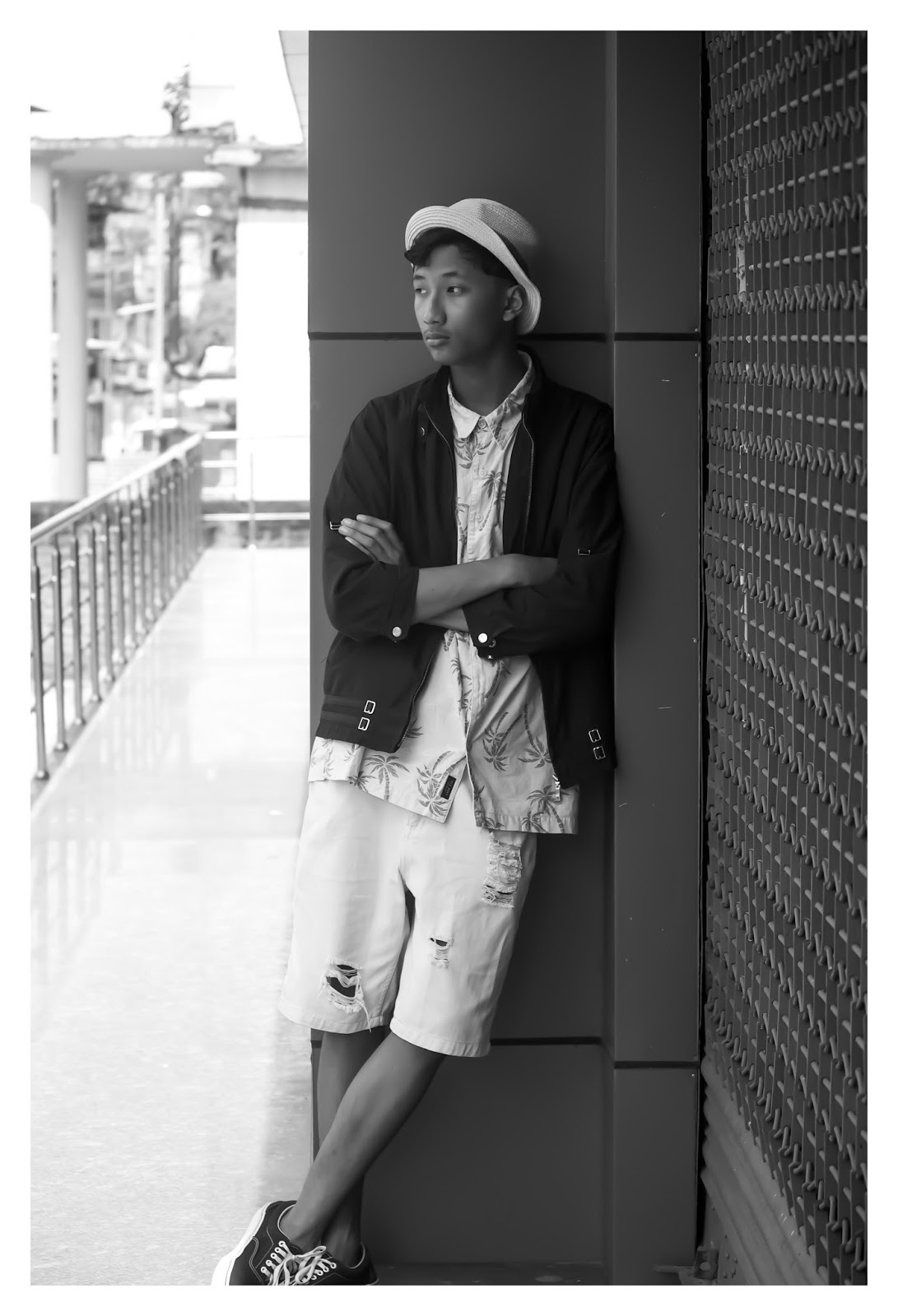 TheQuirkyMinimal by Kangkan Rabha for Farfetch Apple Music partnership wearing Vintage Prada jacket, Old Navy Printed shirt, Thrifted DIY pants, Black Vans via Jabong, Levis Hat